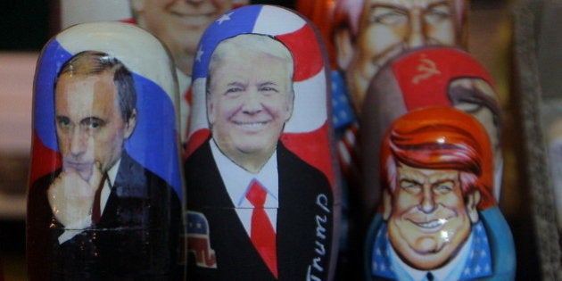 Traditional Russian wooden matryoshka doll with a picture of President-elect Donald Trump (center) and Russian President Vladimir Putin (left) at the fair on the Red Square in Moscow. Russia, Friday, January 6, 2017 Hacker attacks have not affected the results of the US presidential election. This was stated by the president-elect of the United States by Donald Trump on Friday, January 6, 2017 (Photo by Danil Shamkin/NurPhoto via Getty Images)