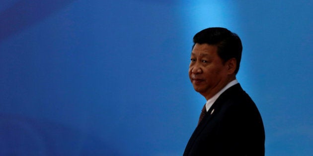 FILE PHOTO - Chinese President Xi Jinping waits for leaders to arrive before the opening ceremony in the Expo Center at the fourth Conference on Interaction and Confidence Building Measures in Asia (CICA) summit in Shanghai May 21, 2014. REUTERS/Aly Song/File Photo