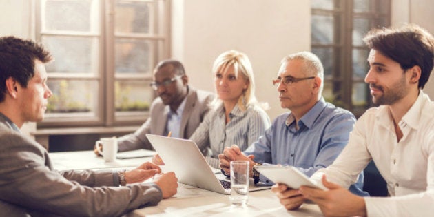 Group of business colleagues having a job interview with their potential colleague.