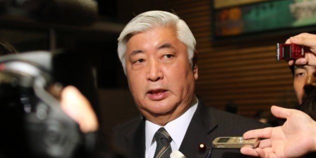 Japanese Defense Minister Gen Nakatani speakes to reporters after a cabinet meeting at the prime minister's official residence in Tokyo on January 25, 2015. Japan's government said it was attempting to verify a video posted online announcing the execution of one of two Japanese hostages held captive by Islamic State militants. 'A new video apparently showing Kenji (Goto) was posted on the Internet,' chief government spokesman Yoshihide Suga said. 'We are collecting information'. AFP PHOTO / Yoshikazu TSUNO (Photo credit should read YOSHIKAZU TSUNO/AFP/Getty Images)
