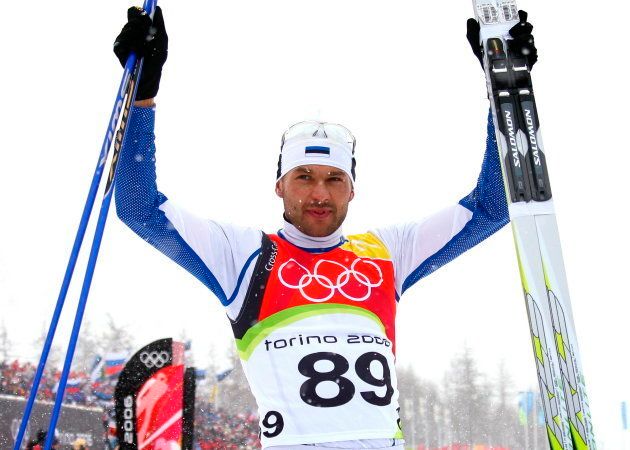 Estonia's Andrus Veerpalu raises his arms in jubilation after winning the men's 15km cross country skiing race at the Torino 2006 Winter Olympic Games in Pragelato, Italy, February 17, 2006. [Estonia's Veerpalu won the race ahead of Czech Republic's Lukas Bauer and Germany's Tobias Angerer.]