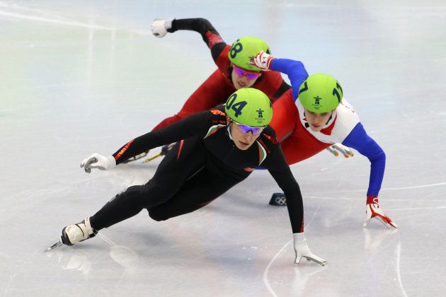 VANCOUVER, BC - FEBRUARY 13: Evgeniya Radanova of Bulgaria leads Veronique Pierron of France and Nannan Zhao of China in the Ladies' 500 m Short Track on day 2 of the Vancouver 2010 Winter Olympics at Pacific Coliseum on February 13, 2010 in Vancouver, Canada. (Photo by Cameron Spencer/Getty Images)
