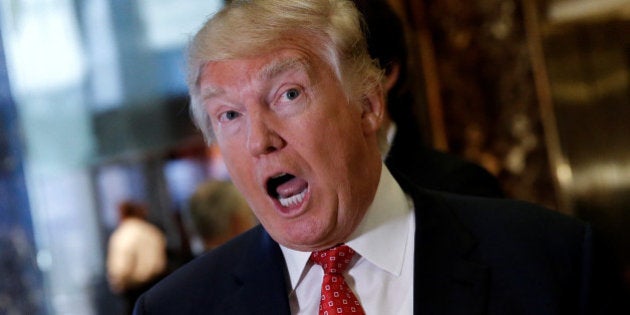 U.S. President-elect Donald Trump reacts to questions from reporters in the lobby at Trump Tower in New York, U.S., January 9, 2017. REUTERS/Mike Segar