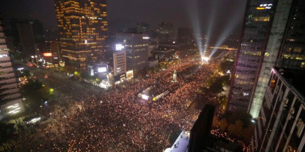 South Korean protesters stage a rally calling for South Korean President Park Geun-hye to step down in downtown Seoul, South Korea, Saturday, Nov. 5, 2016. Police had anticipated that about 40,000 people would turn out Saturday for the largest anti-government protest in the capital in nearly a year. (AP Photo/Ahn Young-joon)