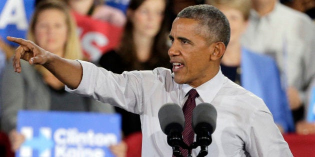 President Barack Obama speaks during a campaign rally for Democratic presidential candidate Hillary Clinton in Charlotte, N.C., Friday, Nov. 4, 2016. (AP Photo/Chuck Burton)