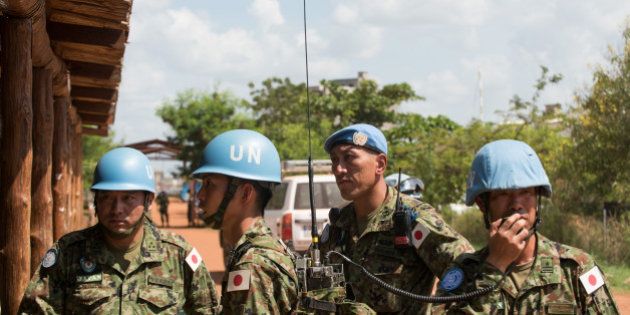 Japanese United Nations Mission in the Republic of South Sudan (UNMISS) troops wait for the arrival of the Japanese minister of defence at the UNMISS base in Tomping Juba on October 8, 2016. Japanese Minister of Defence Tomomi Inada is to hold talks with the South Sudan Ministry of Defence regarding Japan sending peace keepers to South Sudan in an expanding role of more engagement in peace building efforts, and bilateral cooperation. / AFP / Charles Atiki Lomodong (Photo credit should read CHARLES ATIKI LOMODONG/AFP/Getty Images)