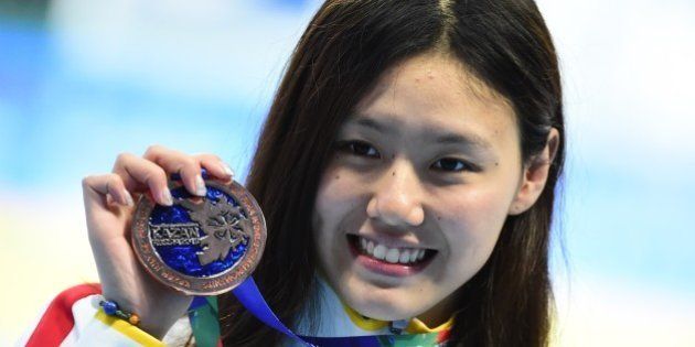 China's Liu Xiang poses with her bronze medal during the podium ceremony for the women's 50m backstroke swimming event at the 2015 FINA World Championships in Kazan on August 6, 2015. AFP PHOTO / ALEXANDER NEMENOV (Photo credit should read ALEXANDER NEMENOV/AFP/Getty Images)