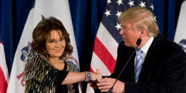 Former Alaska Gov. Sarah Palin, left, endorses Republican presidential candidate Donald Trump during a rally at the Iowa State University, Tuesday, Jan. 19, 2016, in Ames, Iowa. (AP Photo/Mary Altaffer)