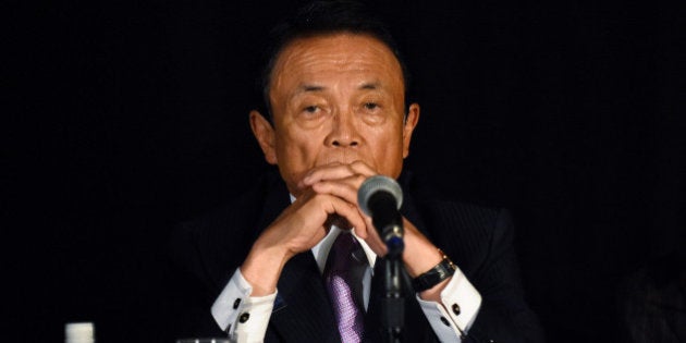 Japanese Finance Minister Taro Aso takes questions from reporters at the Willard Intercontinental hotel during the annual meetings of the IMF and World Bank Group in Washington October 7, 2016. REUTERS/James Lawler Duggan