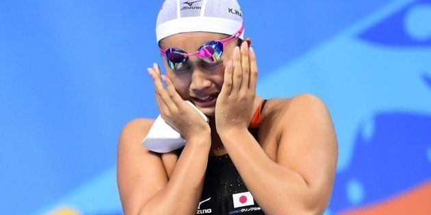 Japan's Kanako Watanabe celebrates after winning the final of the women's 200m breaststroke swimming event at the 2015 FINA World Championships in Kazan on August 7, 2015. AFP PHOTO / ALEXANDER NEMENOV (Photo credit should read ALEXANDER NEMENOV/AFP/Getty Images)