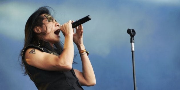 DERBY, UNITED KINGDOM - AUGUST 11: Freddy Lim of Chthonic performs on stage during day 2 of Bloodstock Open Air 2012 at Catton Hall on August 11, 2012 in Derby, United Kingdom. (Photo by Gary Wolstenholme/Redferns via Getty Images)