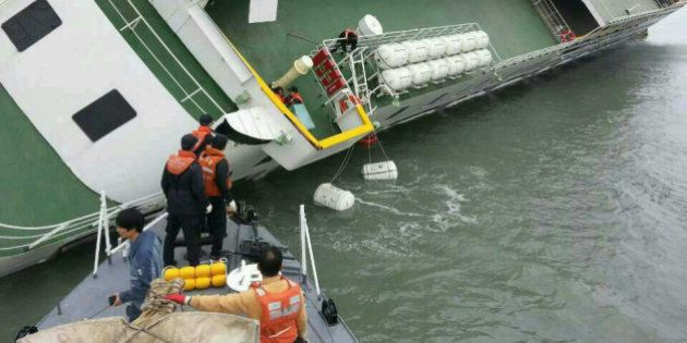 JINDO-GUN, SOUTH KOREA - APRIL 16: In this handout image provided by the Republic of Korea Coast Guard, passengers are rescued by the Republic of Korea Coast Guard from a ferry sinking off the coast of Jindo Island on April 16, 2014 in Jindo-gun, South Korea. The ferry identified as the Sewol was carrying about 470 passengers, including students and teachers, traveling to Jeju island. (Photo by The Republic of Korea Coast Guard via Getty Images)