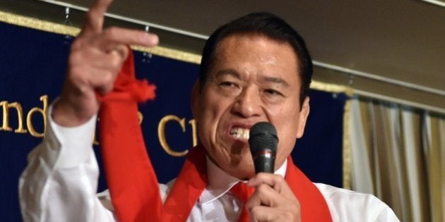 Former professional wrestler and Japan's Upper House member Antonio Inoki shouts at a press conference in Tokyo on August 21, 2014. Inoki will visit Pyongyang to promote a professional wrestling event at the end of August. AFP PHOTO / Yoshikazu TSUNO (Photo credit should read YOSHIKAZU TSUNO/AFP/Getty Images)