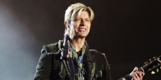 NEWPORT, ENGLAND - JUNE 13: David Bowie performs on stage on the third and final day of 'The Nokia Isle of Wight Festival 2004' at Seaclose Park, on June 13, 2004 in Newport, UK. The third annual rock festival takes place during the Isle of Wight Festival which runs from June 4-19. (Photo by Louise Wilson/Getty Images)