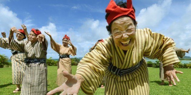 TO GO WITH AFP STORY BY ALASTAIR HIMMERIn this picture taken on June 22, 2015, an elderly women troupe of singers and dancers from Kohama Island in Okinawa wearing traditional local costumes perform at a herb garden on Kohama Island, Okinawa Prefecture. They joke about knocking on heaven's door, but a Japanese 'girl band' named KBG84, with an average age of 84 have struck a blow for grannies everywhere by becoming pop idols. AFP PHOTO / Toru YAMANAKA (Photo credit should read TORU YAMANAKA/AFP/Getty Images)