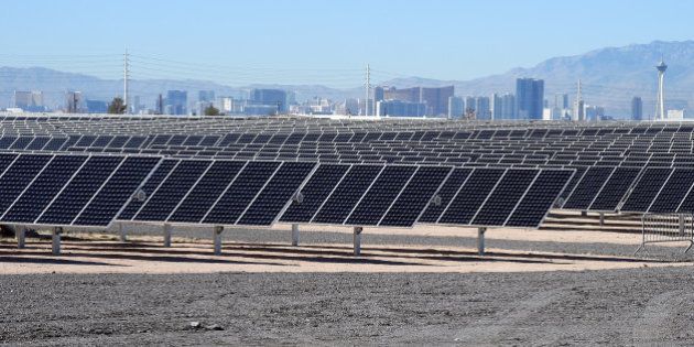 LAS VEGAS, NV - FEBRUARY 16: The Las Vegas Strip is shown behind solar panels during a dedication ceremony to commemorate the completion of the 102-acre, 15-megawatt Solar Array II Generating Station at Nellis Air Force Base on February 16, 2016 in Las Vegas, Nevada. When coupled with the 13.2-megawatt Nellis Solar Star project completed in 2007, Nellis has the largest solar photovoltaic system in the Department of Defense. During daylight hours the two solar fields combined provide almost all of the base's energy needs or about 42 percent of its overall electricity requirements. Power from the array that is not used will go to the NV Energy grid and back into the local community. (Photo by Ethan Miller/Getty Images)
