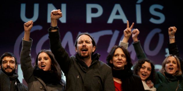 Podemos party leader Pablo Iglesias, center, and other party leaders celebrate following the latest official election results in Madrid, Monday, Dec. 21, 2015. Podemos supporters gathered outside their party headquarters in Madrid cheering as general election results began to roll in confirming the newcomer on the political scene looked set to capture 68 seats and a chance of forming a coalition in parliament.(AP Photo/Daniel Ochoa de Olza)
