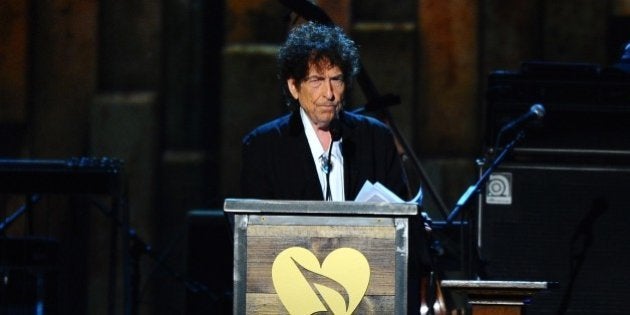 Bob Dylan accepts the 2015 MusiCares Person of the Year award on stage at the 2015 MusiCares Person of the Year show at the Los Angeles Convention Center on Friday, Feb. 6, 2015, in Los Angeles. (Photo by Vince Bucci/Invision/AP)