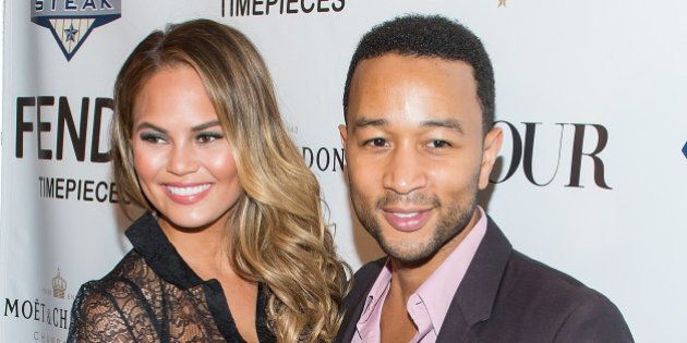 NEW YORK, NY - JULY 28: Model Chrissy Teigen (L) and musician John Legend attend the DuJour celebration of cover star Chrissy Teigen at NYY Steak Manhattan on July 28, 2014 in New York City. (Photo by Michael Stewart/WireImage)