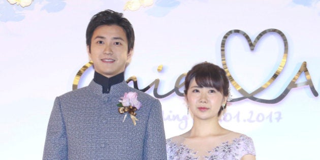 TAIPEI, TAIWAN - JANUARY 01: Taiwanese table tennis player Chiang Hung-chieh meets media with his wife Japanese table tennis player Ai Fukuhara during their wedding ceremony on January 1, 2016 in Taipei, Taiwan of China. (Photo by VCG/VCG via Getty Images)