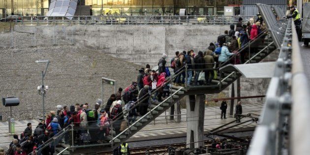 Police organize the line of refugees on the stairway leading up from the trains arriving from Denmark at the Hyllie train station outside Malmo, Sweden, November 19, 2015. 600 refugees arrived in Malmo within 3 hours and the Swedish Migration Agency said in a press statement that they no longer can guarantee accommodation for all asylum seekers. AFP PHOTO / TT NEWS AGENCY / JOHAN NILSSON +++ SWEDEN OUT +++ (Photo credit should read JOHAN NILSSON/AFP/Getty Images)