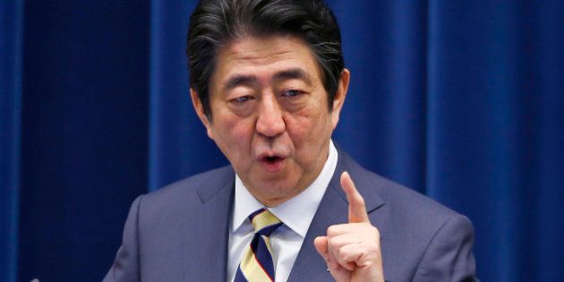 Japanese Prime Minister Shinzo Abe speaks to the media during the New Year's press conference at his official residence in Tokyo, Monday, Jan. 4, 2016. (AP Photo/Shizuo Kambayashi)