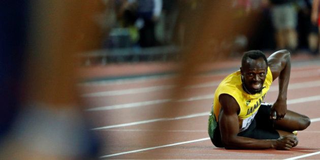 Athletics - World Athletics Championships â menâs 4 x 100 meters relay final â London Stadium, London, Britain â August 12, 2017 â Usain Bolt of Jamaica lays on the track after sustaining an injury. REUTERS/Lucy Nicholson TPX IMAGES OF THE DAY