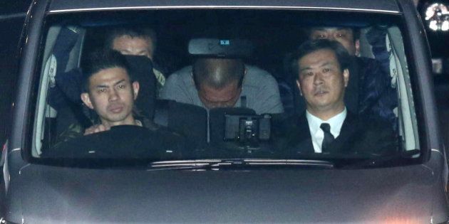 Former Japanese baseball star Kazuhiro Kiyohara (C) is transported into the Tokyo metropolitan police headquarters early on February 3, 2016. Former Japanese baseball star Kazuhiro Kiyohara has been arrested on suspicion of possessing stimulant drugs, Tokyo police said on February 3, 2016, in a humiliating fall from grace for the one-time sporting idol. The 48-year-old former Yomiuri Giants slugger, once one of the biggest names in Japanese baseball, was taken into custody and accused of possession of approximately 0.1 grams of an undisclosed substance after police raided his home in the plush Azabu district of Tokyo late on February 2. JAPAN OUT -- AFP PHOTO / JIJI PRESS / AFP / JIJI PRESS / JIJI PRESS (Photo credit should read JIJI PRESS/AFP/Getty Images)