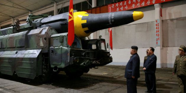 FILE PHOTO - North Korean leader Kim Jong Un inspects the long-range strategic ballistic rocket Hwasong-12 (Mars-12) in this undated photo released by North Korea's Korean Central News Agency (KCNA) on May 15, 2017. KCNA via REUTERS/File photo REUTERS ATTENTION EDITORS - THIS IMAGE WAS PROVIDED BY A THIRD PARTY. EDITORIAL USE ONLY. REUTERS IS UNABLE TO INDEPENDENTLY VERIFY THIS IMAGE. NO THIRD PARTY SALES. SOUTH KOREA OUT.