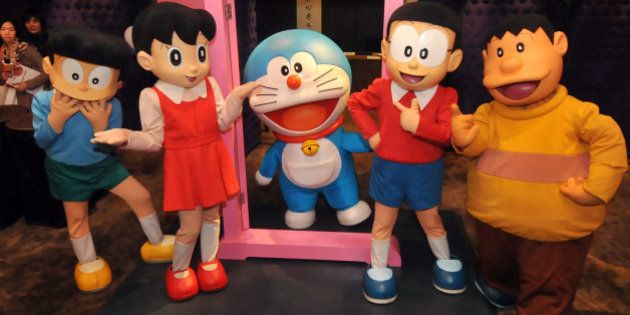 Doraemon (C), Japan's robot cat from the future, and the other characters of the popular manga strips created in 1969, pose for photos during a pre-show press conference in Taipei on December 3, 2012. The show, about Doraemon and the rest of Japanese cartoon characters in the manga strips, will be held in Taipei from December 29 through April 7, 2013. The cartoon exploits of the electronic feline have captivated children across Asia. AFP PHOTO / Mandy CHENG (Photo credit should read Mandy Cheng/AFP/Getty Images)