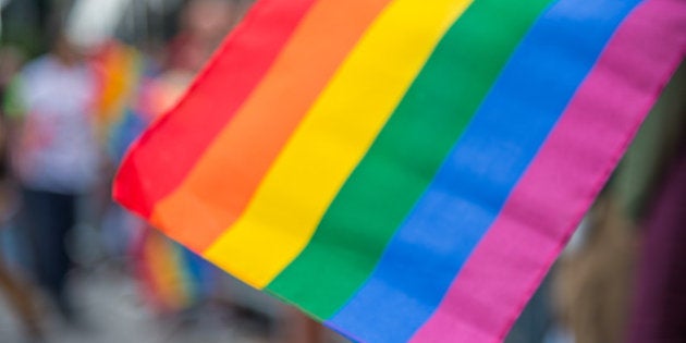 Blurred picture of a gay rainbow flag at a pride parade