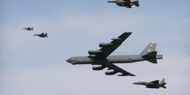 A U.S. Air Force B-52 bomber flies over Osan Air Base in Pyeongtaek, South Korea, Sunday, Jan. 10, 2016. The powerful U.S. B-52 bomber flew low over South Korea on Sunday, a clear show of force from the United States as a Cold War-style standoff deepened between its ally Seoul and North Korea following Pyongyang's fourth nuclear test. (AP Photo/Ahn Young-joon)