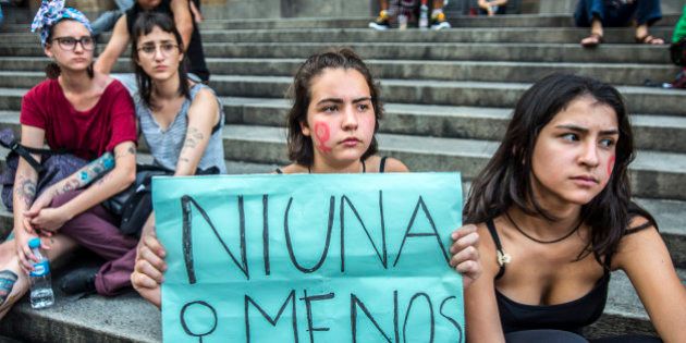 Women take part in a protest in Sao Paulo, Brazil - where protesters held a one-hour 'women's strike'- on October 19, 2016, to protest against violence against women and in solidarity for the brutal killing of a 16-year-old girl in Mar del Plata The killing, in which the high school student was allegedly raped and impaled on a spike by drug dealers, is just the latest incident of horrific gender violence in Argentina, to protest brutality against women. (Photo by Cris Faga/NurPhoto via Getty Images)