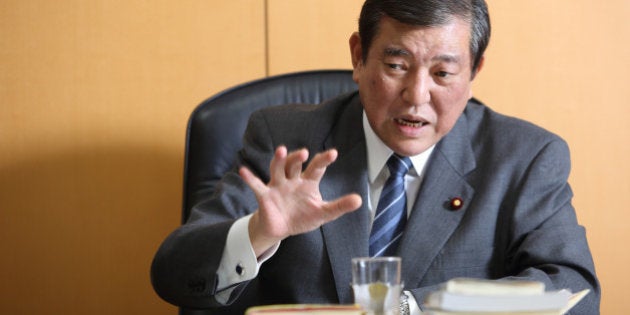 Shigeru Ishiba, Japan's minister in charge of overcoming population decline and vitalizing local economy, gestures as he speaks during an interview in Tokyo, Japan, on Wednesday, Jan. 21, 2015. The Abe government's chief for regional Japan looks into the future and sees enterprising communities that maintain their grip on state funding and flourish, and stragglers that are cut loose. Photographer: Tomohiro Ohsumi/Bloomberg via Getty Images