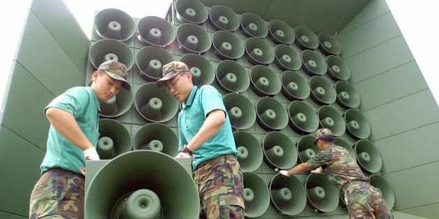 PAJU, REPUBLIC OF KOREA: South Korean soldier tear down a battery of propaganda loudspeakers along the border with North Korea in Paju on 16 June 2004. The dismantlement followed an inter-Korean to remove all propaganda materials along the world's last Cold War frontier.AFP PHOTO/ KIM JAE-HWAN (Photo credit should read KIM JAE-HWAN/AFP/Getty Images)