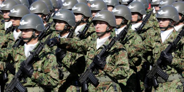 FILE - In this Oct. 27, 2013 file photo, members of Japan Self-Defense Forces march during the Self-Defense Forces Day at Asaka Base, north of Tokyo. Several Asian nations are arming up, their wary eyes fixed squarely on one country: a resurgent China thatâs boldly asserting its territorial claims all along the East Asian coast. The scramble to spend more defense dollars comes amid spats with China over contested reefs and waters. Other Asian countries such as India and South Korea are quickly modernizing their forces, although their disputes with China have stayed largely at the diplomatic level. (AP Photo/Shizuo Kambayashi, File)