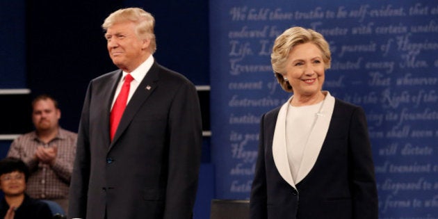 Republican U.S. presidential nominee Donald Trump and Democratic U.S. presidential nominee Hillary Clinton appear together during their presidential town hall debate at Washington University in St. Louis, Missouri, U.S., October 9, 2016. REUTERS/Mike Segar