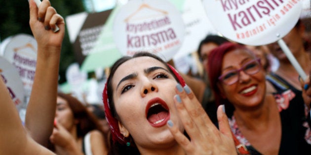 Women rights activists shout slogans during a protest against what they say are violence and animosity they face from men demanding they dress more conservatively, in Istanbul, Turkey, July 29, 2017. REUTERS/Murad Sezer