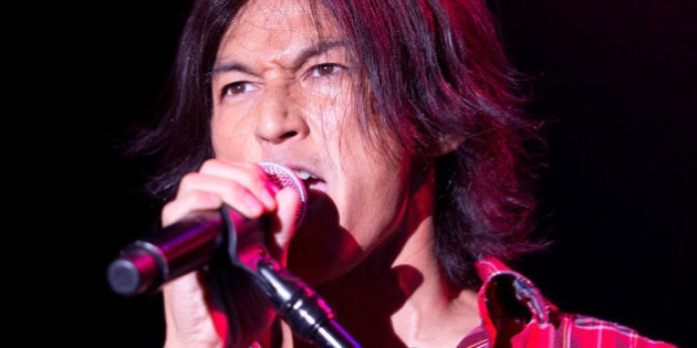 NEW YORK, NY - SEPTEMBER 30: Koshi Inaba of B'z performs on stage at Best Buy on September 30, 2012 in New York, United States. (Photo by Daniel Boczarski/Redferns via Getty Images)