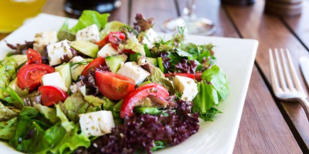 Greek Mediterranean salad with feta cheese, tomatoes and peppers. Mediterranean salad. Mediterranean cuisine. Greek cuisine.