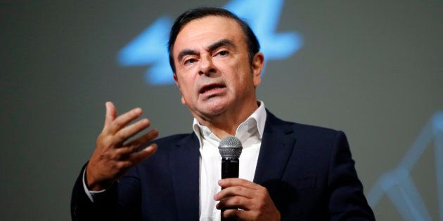 Carlos Ghosn, Chairman and CEO of the Renault-Nissan Alliance, gestures as he speaks during the presentation of the Renault's new Alpine sports concept car