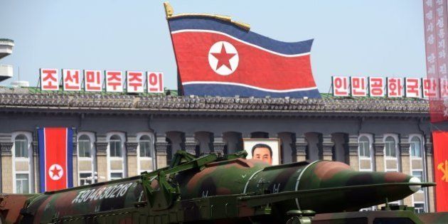 A military vehicle carries what is believed to be a Taepodong-class missile Intermediary Range Ballistic Missile (IRBM), about 20 meters long, during a military parade to mark the 100 birth of the country's founder Kim Il-Sung in Pyongyang on April 15, 2012. The commemorations came just two days after a satellite launch timed to mark the centenary fizzled out embarrassingly when the rocket apparently exploded within minutes of blastoff and plunged into the sea. AFP PHOTO / PEDRO UGARTE (Photo credit should read PEDRO UGARTE/AFP/Getty Images)