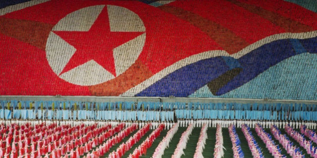 Arirang Mass Games at Mayday Stadium in Pyongyang, North Korea, a 120,000 performer-strong spectacle of gymnastic choreography in one of the biggest sport arenas in the world. At the stand behind the field 30,000 person flip card mosaic to form detailed composite pictures.The performance takes place for two months in August and September. From as young as 5 years old kids are being selected to participate in the Mass Games. For them the intensive practise starts in April.