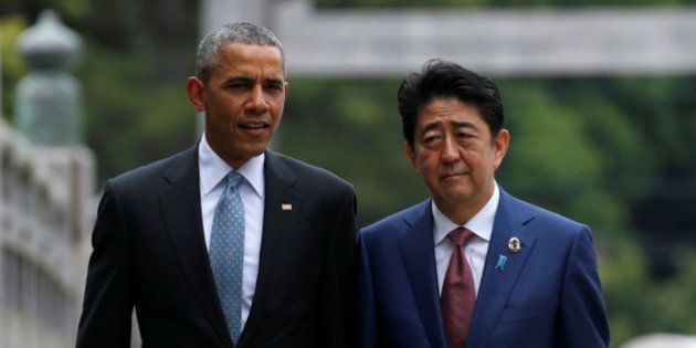 U.S. President Barack Obama (L) talks with Japanese Prime Minister Shinzo Abe on Ujibashi bridge as they visit Ise Grand Shrine in Ise, Mie prefecture, Japan, May 26, 2016, ahead of the first session of the G7 summit meetings. REUTERS/Toru Hanai
