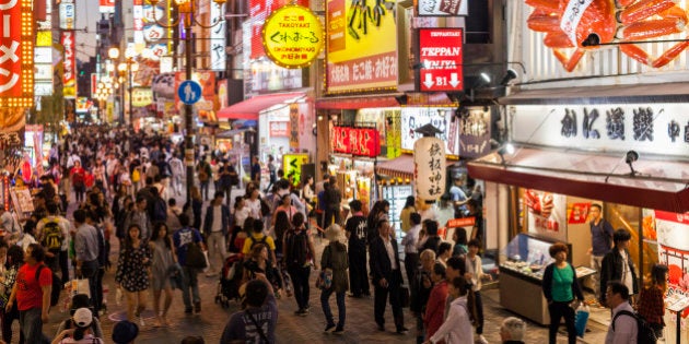 People walking on thefamous Dotonburi shopping street in Osaka, Japan.