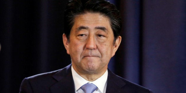 Japanese Prime Minister Shinzo Abe gestures during a press conference in Buenos Aires, Argentina, November 21, 2016. REUTERS/Agustin Marcarian