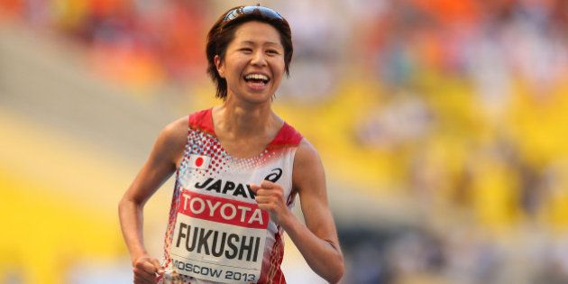 MOSCOW, RUSSIA - AUGUST 10: Kayoko Fukushi of Japan smiles as she crosses the line to win bronze in the Women's Marathon during Day One of the 14th IAAF World Athletics Championships Moscow 2013 at Luzhniki Stadium on August 10, 2013 in Moscow, Russia. (Photo by Julian Finney/Getty Images)