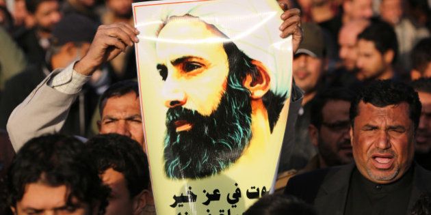 An Iraqi man holds a portrait of prominent Shiite Muslim cleric Nimr al-Nimr during a demonstration against his execution by Saudi authorities, on January 3, 2016, in the capital Baghdad. Iran and Iraq's top Shiite leaders condemned Saudi Arabia's execution of Nimr, warning ahead of protests that the killing was an injustice that could have serious consequences. AFP PHOTO / AHMAD AL-RUBAYE / AFP / AHMAD AL-RUBAYE (Photo credit should read AHMAD AL-RUBAYE/AFP/Getty Images)