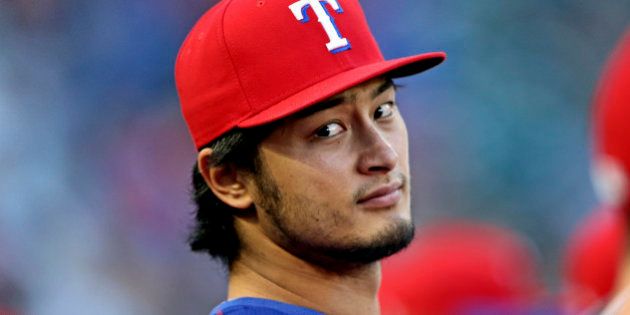 Apr 27, 2016; Arlington, TX, USA; Texas Rangers starting pitcher Yu Darvish (11) sits in the dugout during the second inning against the New York Yankees at Globe Life Park in Arlington. Mandatory Credit: Kevin Jairaj-USA TODAY Sports