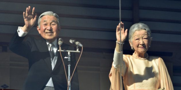 Japanese Emperor Akihito (L) and Empress Michiko wave to well-wishers gathered for the annual New Year's greetings at the Imperial Palace in Tokyo on January 2, 2016. Akihito called for peace in his New Year's greeting to more than 62,000 visitors. AFP PHOTO / KAZUHIRO NOGI / AFP / KAZUHIRO NOGI (Photo credit should read KAZUHIRO NOGI/AFP/Getty Images)